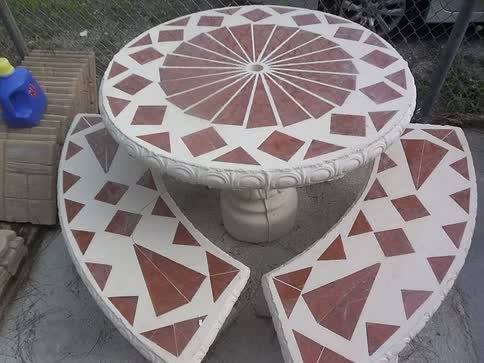 Beige table with red diamond tiles and benches